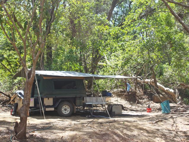 Camp in the shade beside the waterhole.