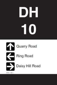 An example of a black and white emergency marker, with a location code (DH) and arrows pointing to the different trails.