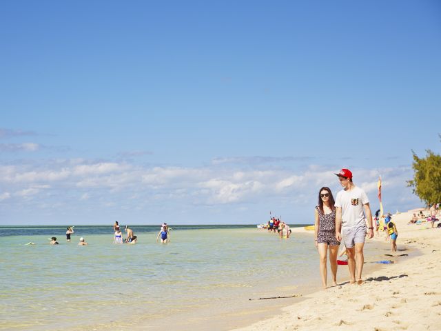 Take a stroll along the white sands of Green Island.