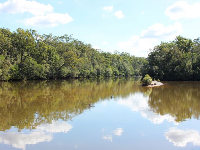 Coochin Creek day-use area is beside the sheltered waters of Coochin Creek.