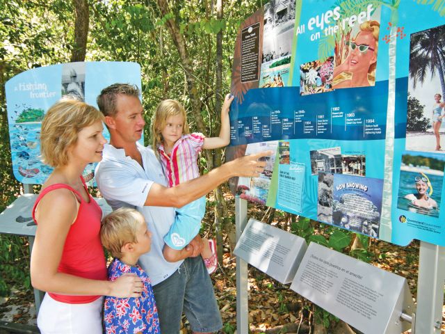 Learn about Green Island's colourful history from signs along the boardwalk.