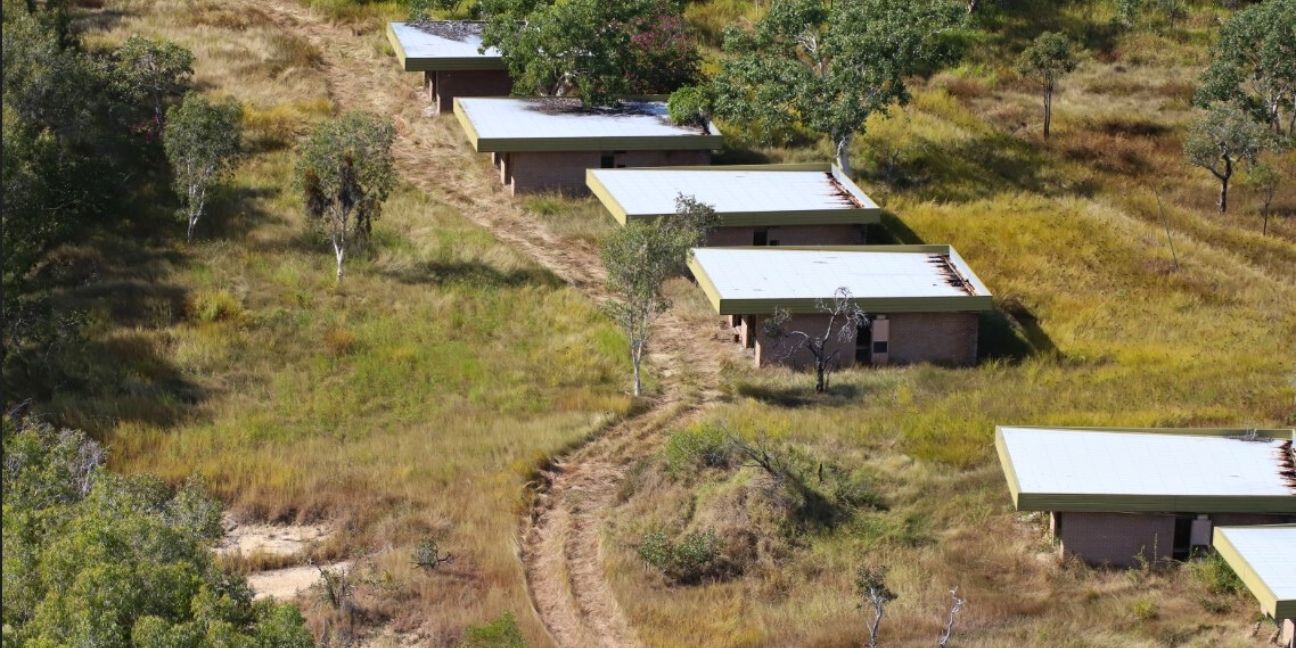 Six of the 20 abandoned, white-roofed villa buildings.