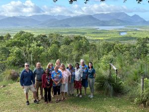 Photo of Queensland Parks and Wildlife Service, World Expeditions, Bandjin, and Girramay representatives overlooking Hinchinbrook Island.