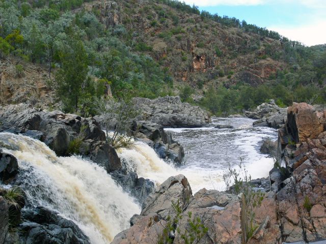 After good rain, water from the Severn River tumbles over broad rocky slabs creating Nundubbermere Falls.