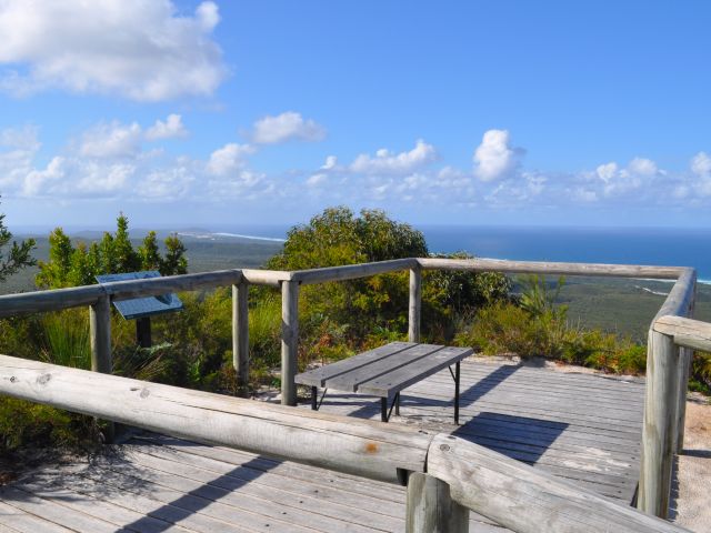 A seat at the Mount Tempest lookout allows you to catch your breath while enjoying the views.