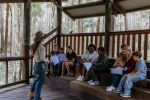 Photo of group of visitors engaging with koala education teacher packs.