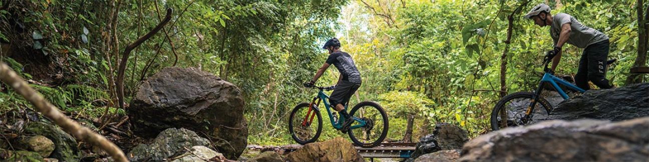 Mountain bike riders crossing bridge in Smithfield Conservation Park