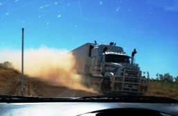 Passing heavy vehicles raises dust clouds and reduces visibility.