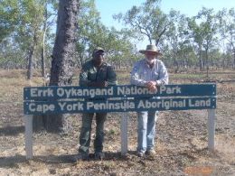 Darren Birchley and Keith McDonald standing over the national park sign.