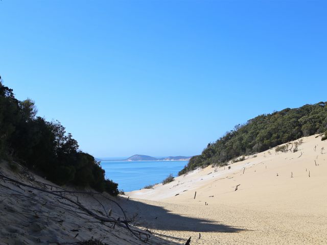 Explore the sand mass of Carlo Sandblow and enjoy extensive views of Rainbow Beach.