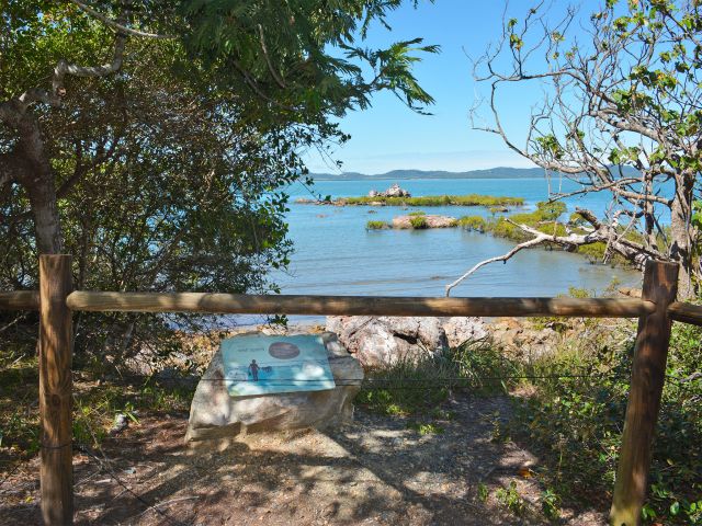 Photo of the remains of a stone fish trap in Sandy Cape can be seen from the Yuwi plant trail.