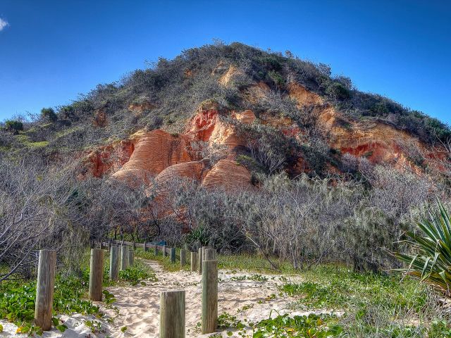 Stroll into Red Canyon and see the layering in the sand dune, exposed by wind and water.