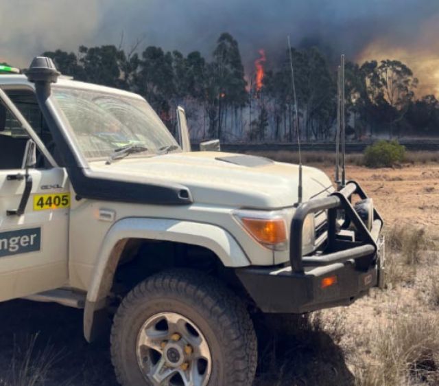 QPWS Ranger vehicle parks near planned burn