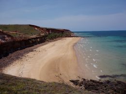 Image of coastal cliffs and fringing reef near Ussher Point camping area.