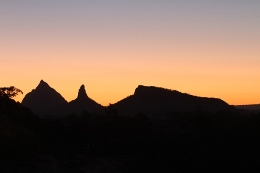 The Glass House Mountains silhouetted against the setting sun, from Moreton Bay. Photo: Ross Naumann, QPWS volunteer. 