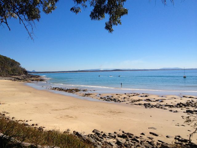 Boaters and jet skiers enjoy the waters off Noosa National Park.