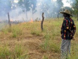 Paddy Yam, assisting in a planned burn on the park. Photo: courtesy of the Kowanyama Photo Archive.