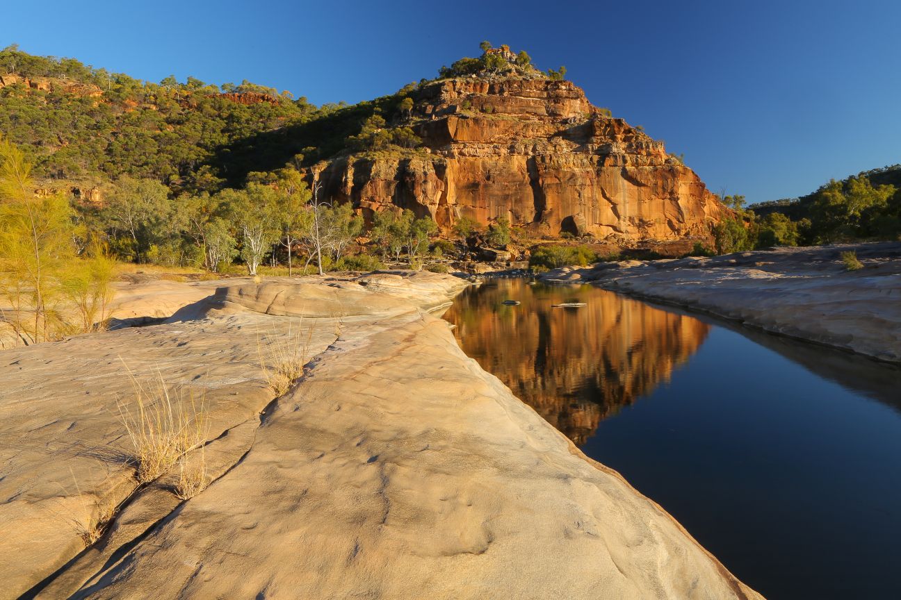 Pyramid shaped outcrop sits above the creek in bottom of gorge.