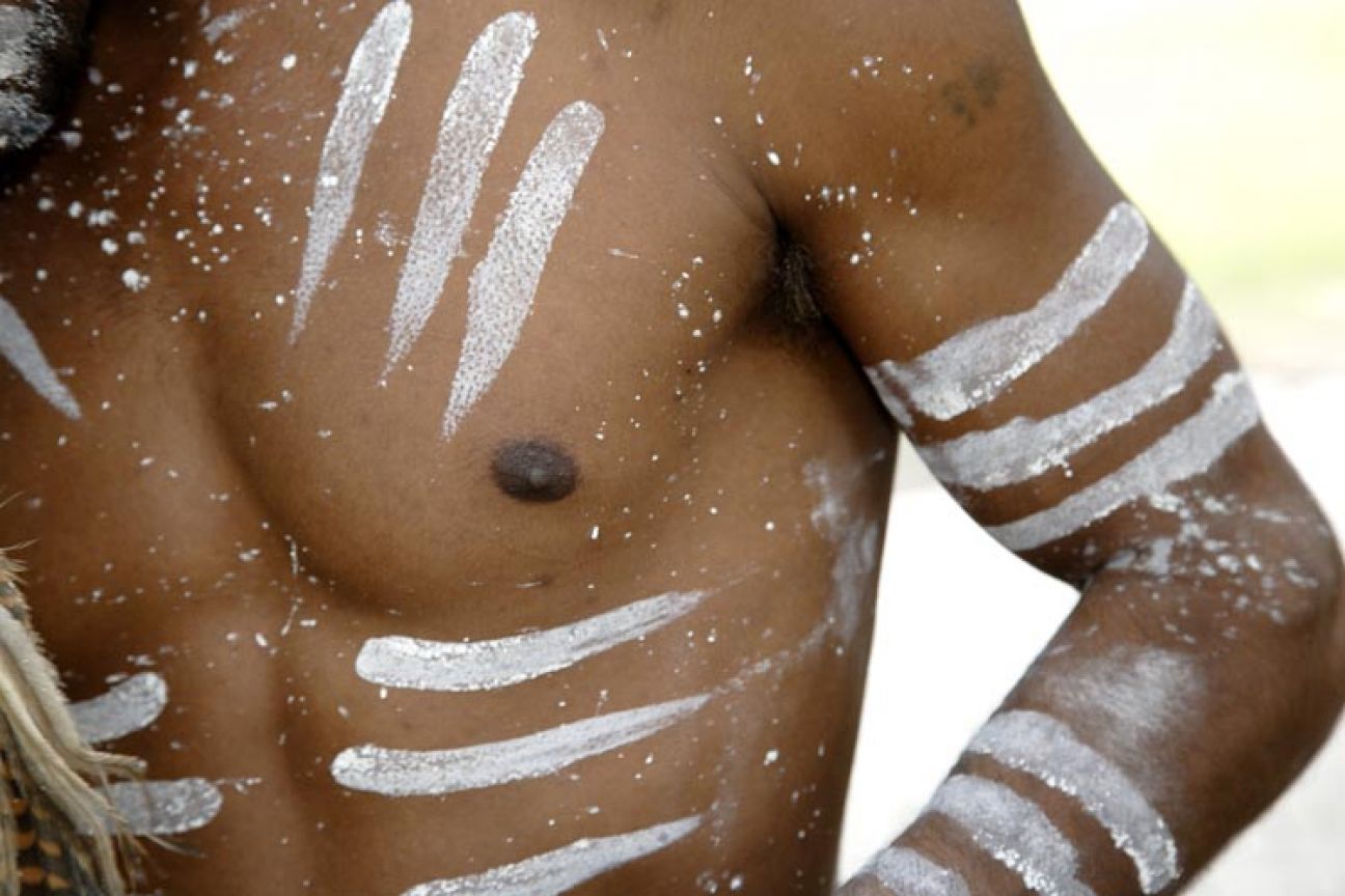 Body paint on this dancer represents the three Butchulla laws.