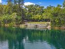 Photo of Lake Eacham day-use area from the perspective of out on the water