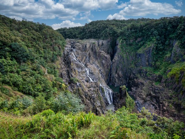 Photo of the water flowing over Barron Falls, which varies with the seasons