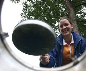 Image of a camper using a fuel stove.