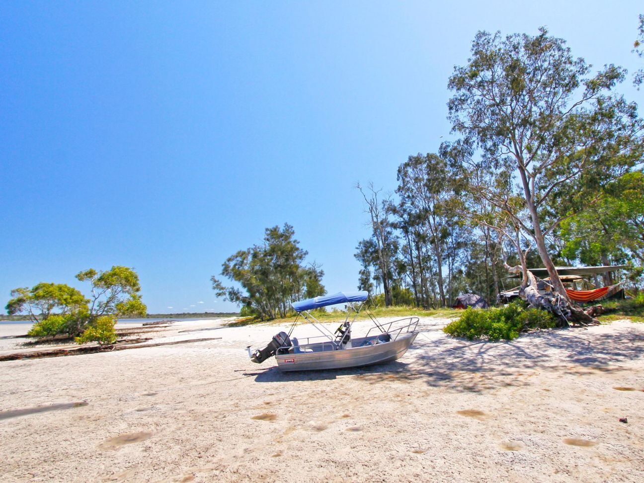 Photo of a tinnie boat on a beach