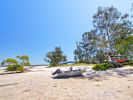 Photo of a tinnie boat on a beach