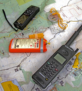 Photo of safety supplies - map, satellite phone