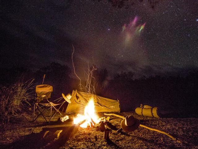 Enjoy a campfire at your Burrows Waterhole camp site.