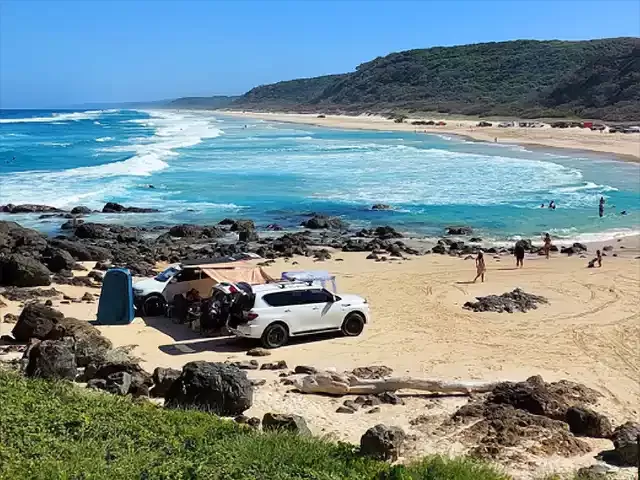 Vehicles parked on beach