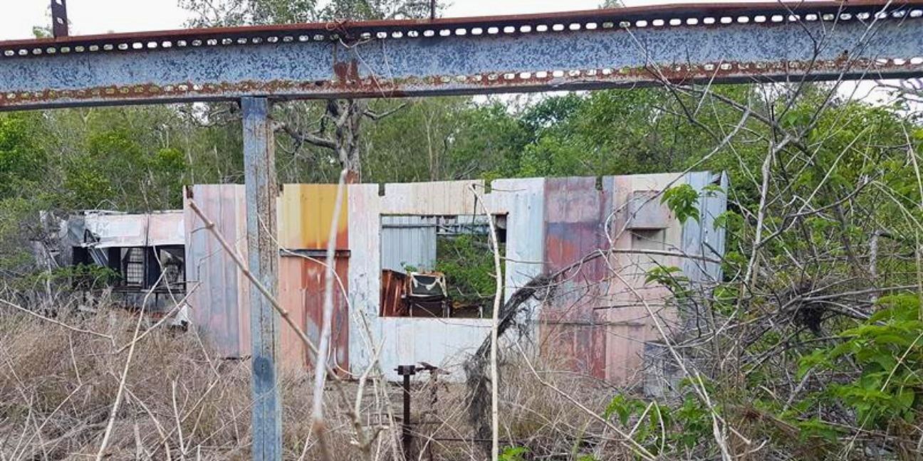 Metal walls and frame of an abandoned shack.